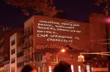 anti-gentrification message projected